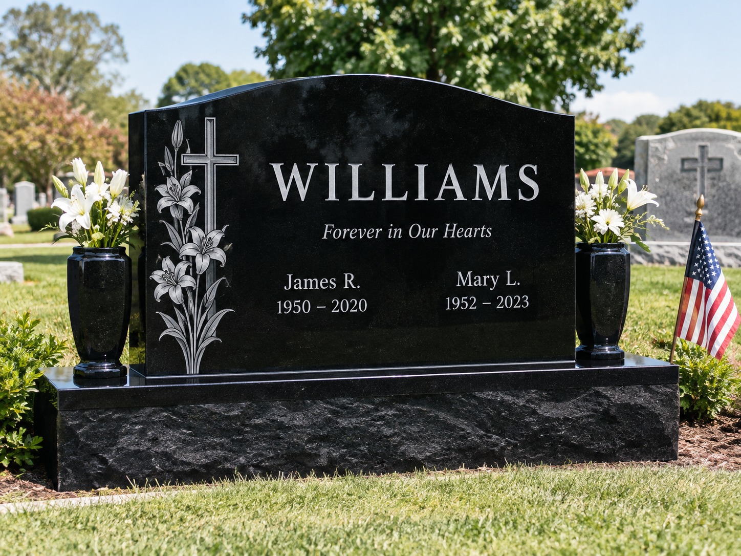 Black granite upright memorial with engraved lilies and cross